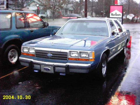 1988 Ford LTD Crown Victoria - Papa Smurf with the new engine sitting under the hood. Still waiting on a bit of tuning. And yeah, there's a chunk of fiberglass missing of…