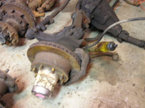 1988 Ford Bronco - Close-up of a disassembled Dana 60 axle assembly, showing rust and wear on components.