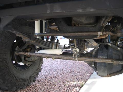 1994 Ford Bronco - Undercarriage detail showing suspension components and rear differential, with a Supermotors.net watermark visible.