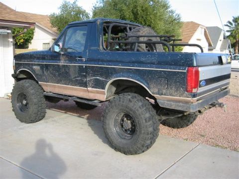 1994 Ford Bronco - This lifted 1994 Ford Bronco features oversized off-road tires and a custom spare tire mount in the rear cargo area.