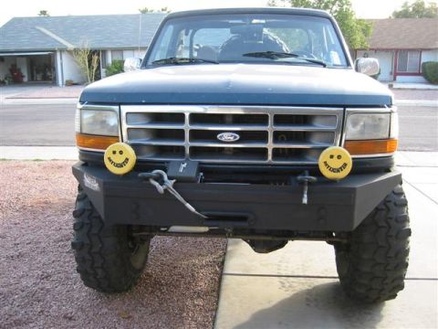 1994 Ford Bronco - This Ford Bronco has a custom bumper and large tires, suggesting off-road use.