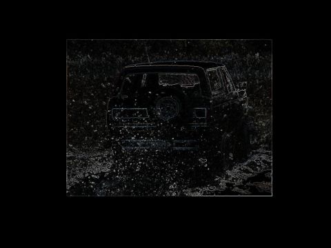 1991 Ford Bronco - This 1991 Ford Bronco is kicking up a lot of water as it drives through a muddy area.