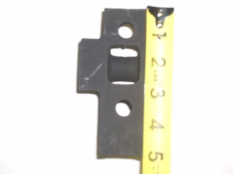 1996 Ford Bronco - A vehicle part is shown next to a measuring tape for scale.