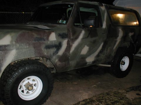 1979 Ford Bronco - This SUV is painted in a camouflage pattern and is seen at night.