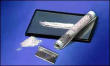 1991 Ford Bronco - A close-up view of items commonly associated with drug use, including a rolled bill, razor blade, and white powder.