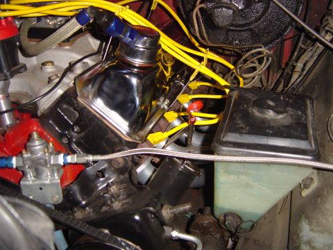 1978 Ford Bronco - The engine bay shows various components including spark plug wires, a valve cover, and a fluid reservoir.