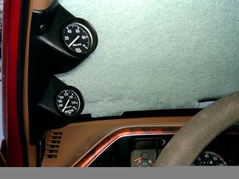1989 Ford Bronco - Interior view of a vehicle's dashboard, showing gauges and a frosted windshield.