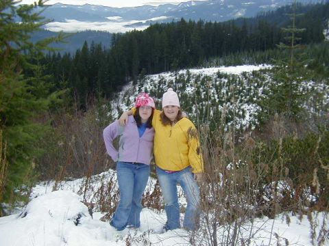 1994 Ford Explorer - Two young people pose for a photo in a snowy, mountainous forest during winter.