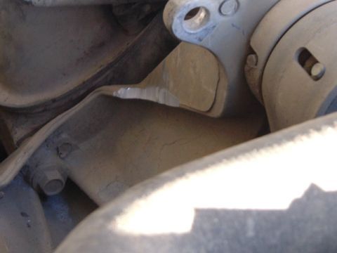 1989 Ford Bronco - A cracked metal bracket, possibly for an alternator, is shown in detail.