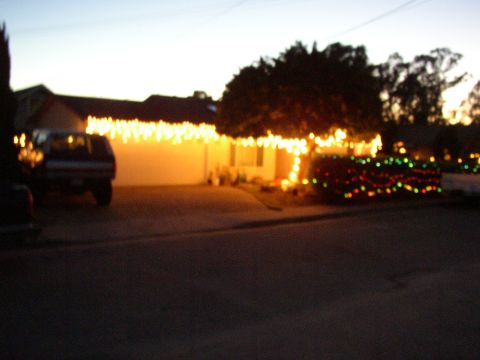 1989 Ford Bronco - An SUV is parked in the driveway of a house decorated with Christmas lights.