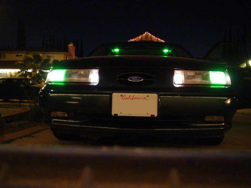 1993 Ford Taurus front with green underglow and headlights