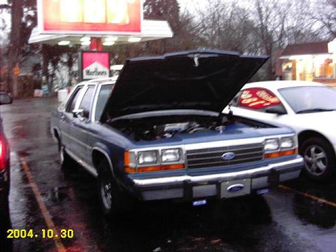 1988 Ford LTD Crown Victoria - Hood popped.