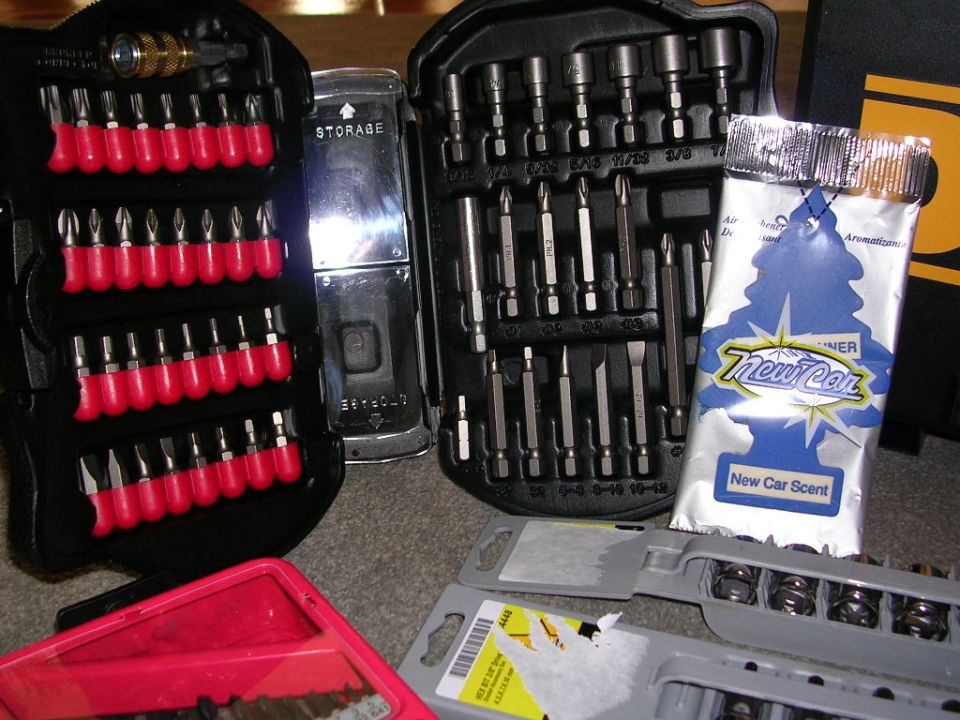 Tool kits with various bits and sockets, plus a New Car Scent air freshener
