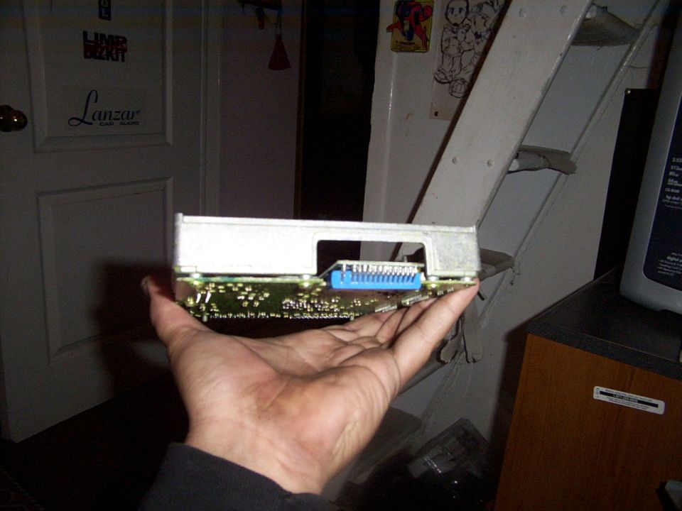 Electronic control unit with blue connector held in hand