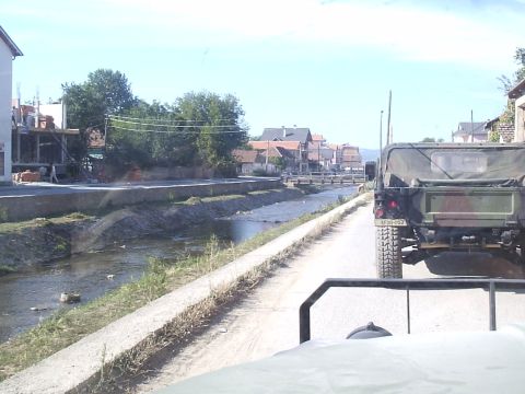 1996 Ford Bronco - town of Vitina creek that runs thru it. Those are not rocks but mostly trash!!