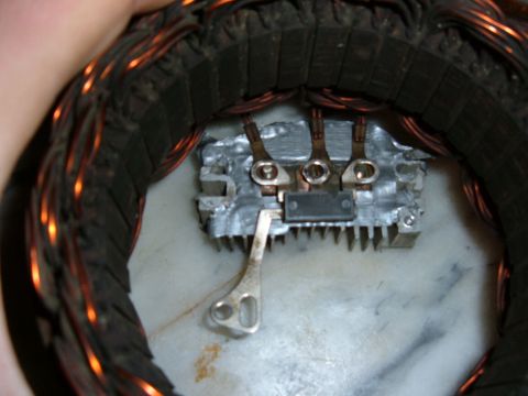 1985 Ford F-150 - Close-up view of an alternator's internal components, including the rotor and regulator.