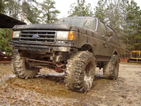 1989 Ford Bronco - This heavily modified Ford Bronco is covered in mud after an off-road excursion.
