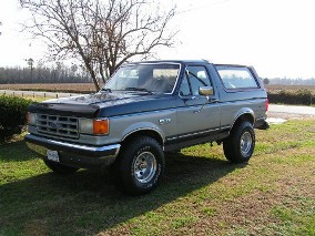 1987 Ford Bronco - This 1987 Ford Bronco is shown from the front three-quarter angle, parked outdoors on a sunny day.