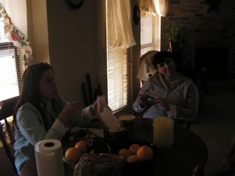1978 Ford Bronco - Two women are seated at a table indoors, with fruit and paper towels visible on the table.