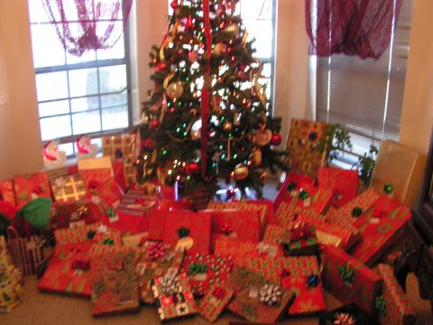 1978 Ford Bronco - A decorated Christmas tree sits amidst a pile of presents, creating a festive holiday scene.