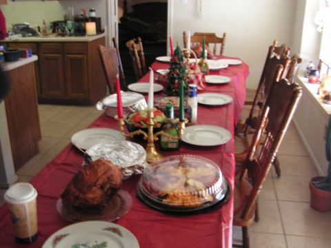 1978 Ford Bronco - A table set for a Christmas dinner, a roast, pie, and holiday decorations.