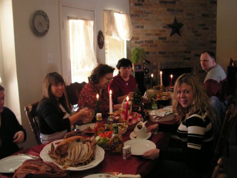 1978 Ford Bronco - A family enjoys a holiday meal together around a decorated dining table.