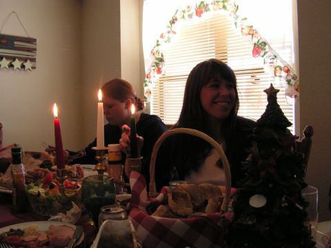 1978 Ford Bronco - A holiday dinner scene with two women, lit candles, and festive decorations.