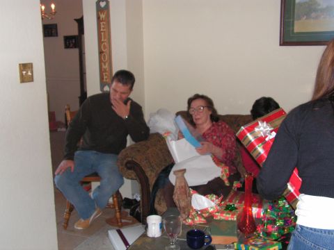 1978 Ford Bronco - A family gathers to open presents during a holiday celebration.