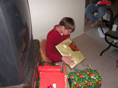 1978 Ford Bronco - A boy is opening a gift on Christmas morning, with many presents around him.