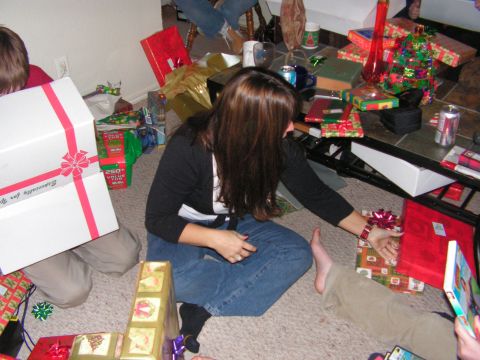 1978 Ford Bronco - A group of people are gathered around opening Christmas presents.