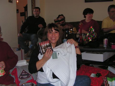 1978 Ford Bronco - A group of people are gathered, opening gifts during a holiday celebration.