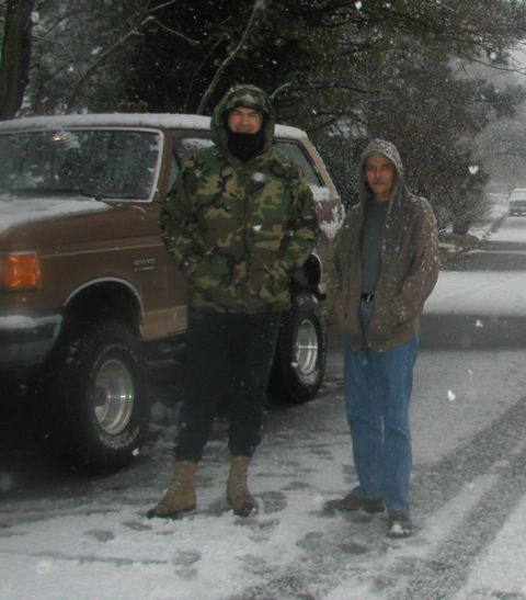 1988 Ford Bronco - Two men pose with a brown Ford Bronco during a snowfall on December 26, 2004.