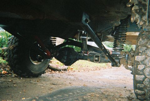 1978 Ford Bronco - Undercarriage view of a modified off-road vehicle's suspension system.