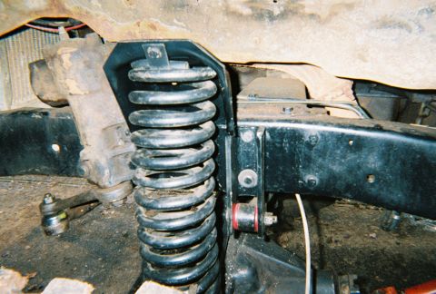 1978 Ford Bronco - Front suspension coil spring and bracket detail.