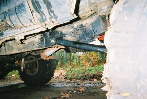 1978 Ford Bronco - Close-up of the undercarriage, showing the frame and suspension components of an off-road vehicle.