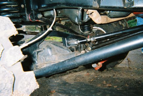 1978 Ford Bronco - Close-up view of the undercarriage, focusing on the suspension and differential components of a vehicle.