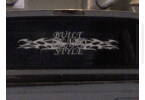 1994 Ford F-150 - A decal with flames and the words 'Built in the USA Style' is affixed to the rear window of a vehicle.