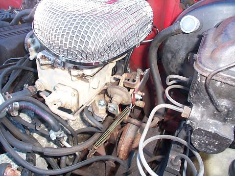 1989 Jeep YJ - Engine bay detail showing the carburetor and associated hoses.