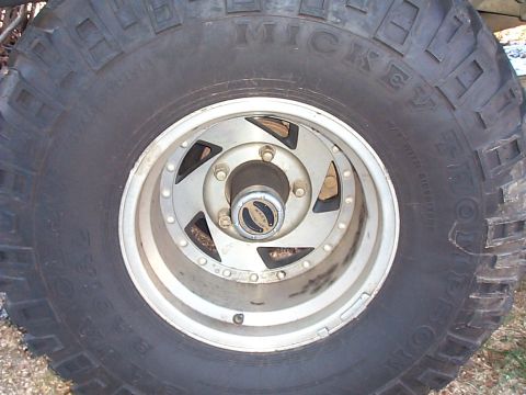 1989 Jeep YJ - Close-up of a Mickey Thompson Baja radial tire on a Jeep wheel with a Warn hub.