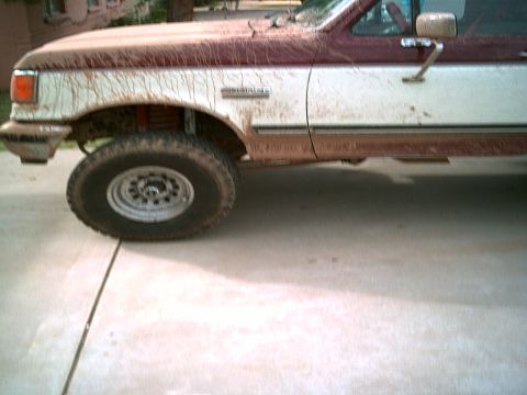 1988 Ford Bronco - This truck is covered in mud, suggesting it has been off-roading recently.