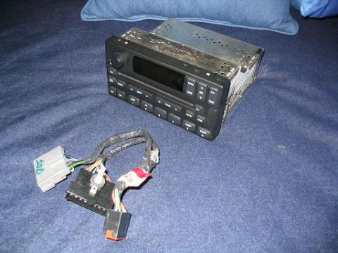 1999 Ford Crown Victoria - A car stereo and its associated wiring harness are shown, possibly for sale or repair.