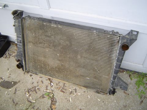 1989 Ford Bronco - Old Radiator out, ready for the trash.