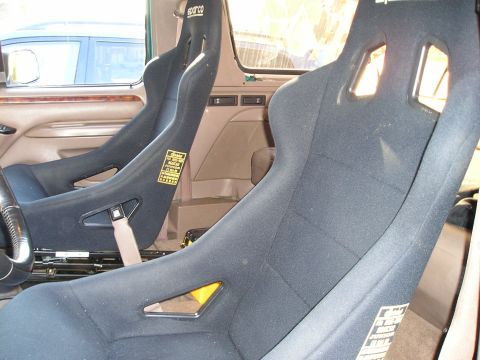 1996 Ford Bronco - Interior view of Sparco racing seats, likely aftermarket modifications.