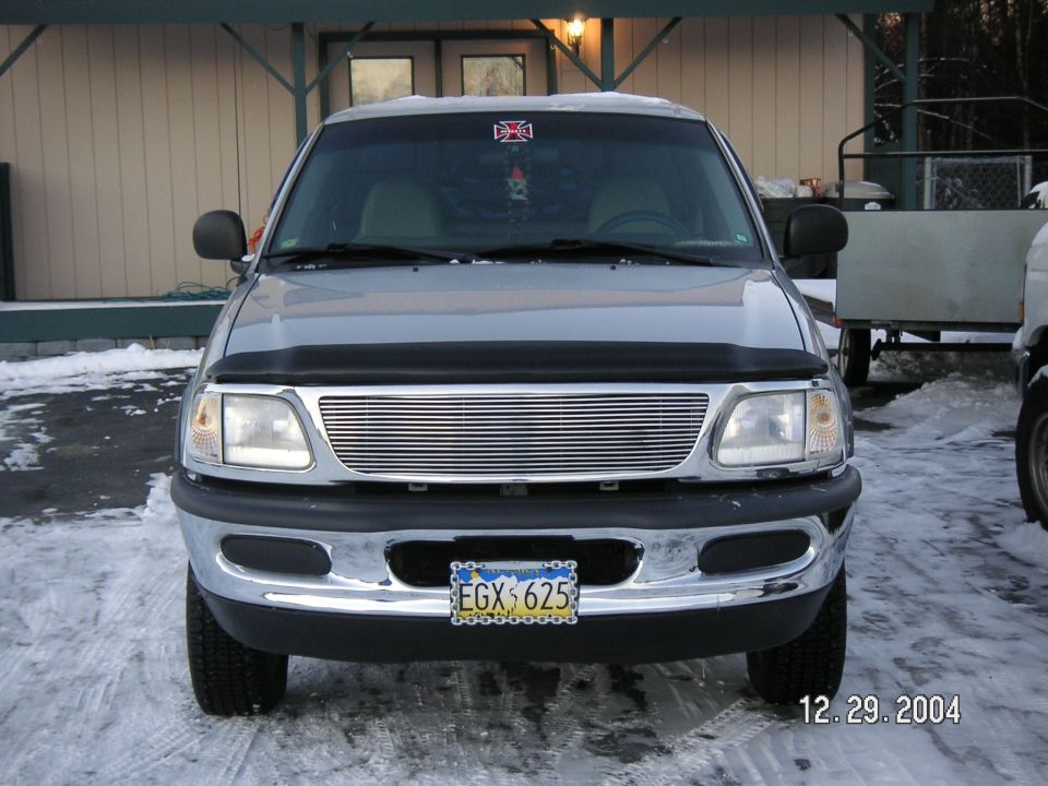 1998 Ford F-150 front view with custom grille and aftermarket wheels