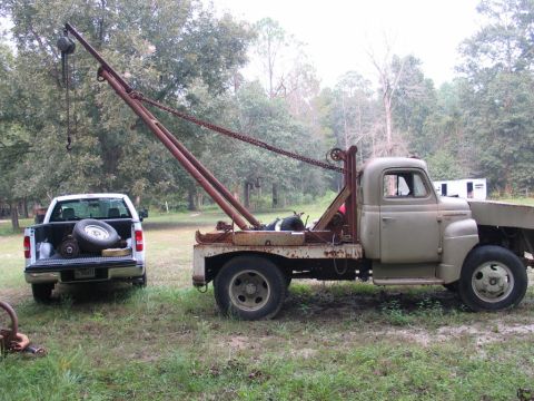 1989 Ford F-150 - Figured this old international would be handy at removing the D44 from my truck. The boom truck doesn't run, btw, so no PTO winch