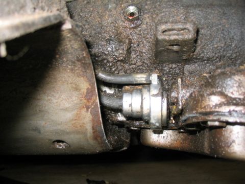 1973 Ford Wagon - Undercarriage view shows greasy components and metal tubing, with a SuperMotors watermark.