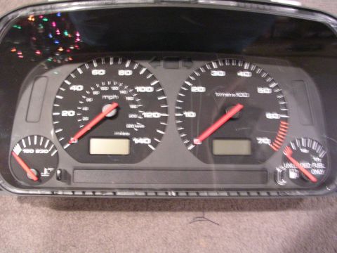 2003 Chevrolet Monte Carlo - Dashboard instrument cluster speedometer, tachometer, and fuel gauge with digital displays.