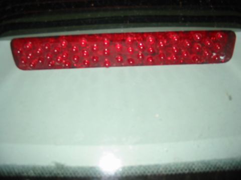 1997 Ford Crown Victoria - The rear third brake light of a 1997 Ford Crown Victoria is visible.