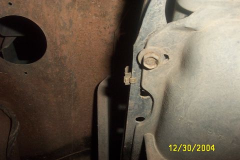1979 Ford F-150 - Close-up view of an underbody component, a bolt and a visible date stamp of 12/30/2004.