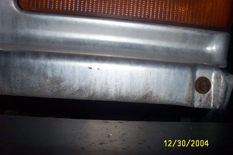 1979 Ford F-150 - Close-up view of a vehicle's chrome bumper and amber turn signal light.